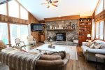 Living and Entertainment area with Woodstove in Waterville Estates Home